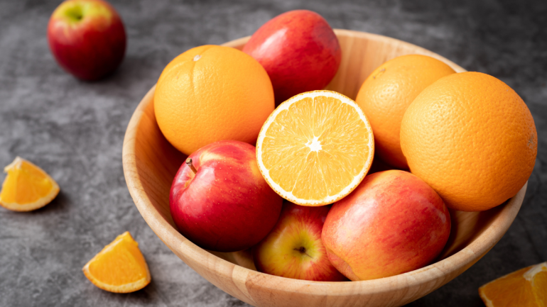 Fruit bowl full of apples and oranges