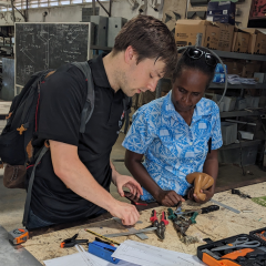 UNSW student working with a project counterpart in the Solomon Islands