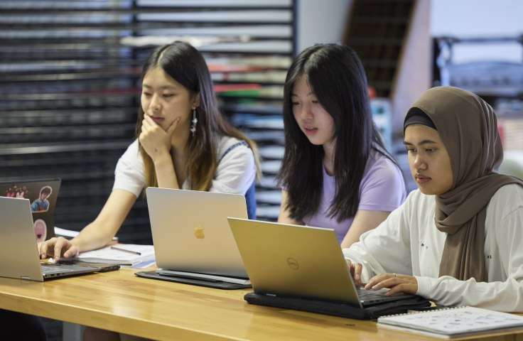 UNSW Art & Design students on laptop